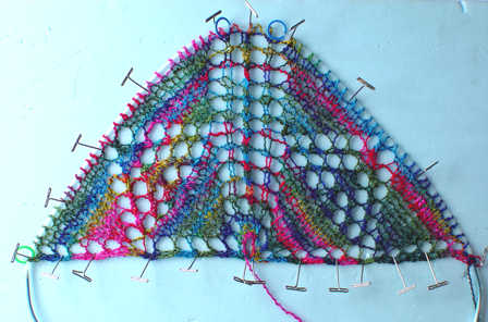 beginning of Triangles Within Triangles shawl being blocked in progress