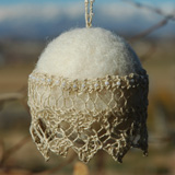 Lace Christmas Ball made by Mary Mauz using hand-knit beaded lace edging and handmade wool felt ball