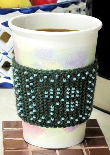 Irish Coffee Cozy. Go Green. Forego cardboard sleeves at your local coffee shop and use instead this attractive beaded shamrock cup cozy to turn plain coffee into no-added-calorie Irish coffee.