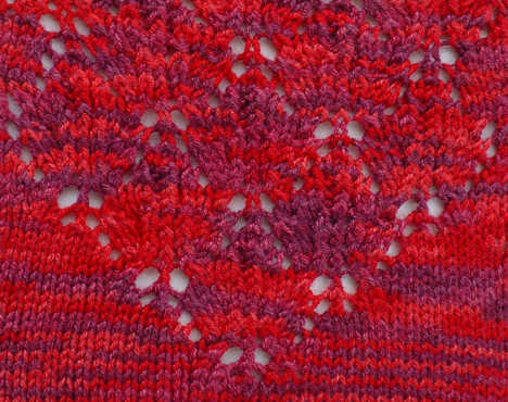 detail stitch pattern from Lace Maple Leaf Socks, shown in Crystal Palace Panda Silk color 4011 Cranberry Tones
